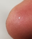 der einzige auffindbare vereinzelbare splitter im schlonz vom magnet. deutlich unter 1 mm lang, dnner als schreibmaschinenpapier. der fingerabdruck ist streng geheim!